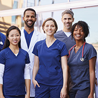 A team of employees smiling at the camera