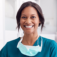 A nurse smiling at the camera